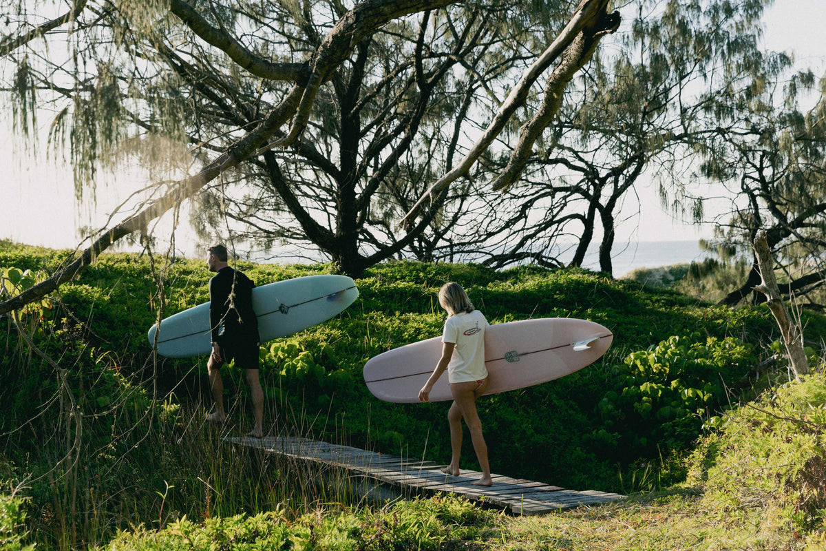 Womens Shealoha 2k25 worn on a coastal walk with surfboards near Sunshine Beach