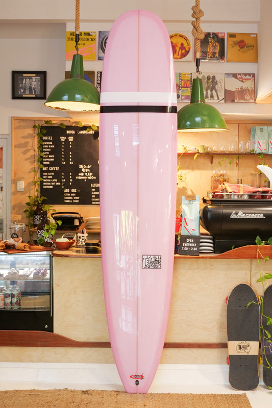 9'3" Noosa Longboards Tea Tree Model pale pink semi pigment deck and bottom, black and white TT bands, gloss and polish