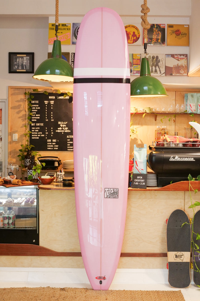 9'3" Noosa Longboards Tea Tree Model pale pink semi pigment deck and bottom, black and white TT bands, gloss and polish