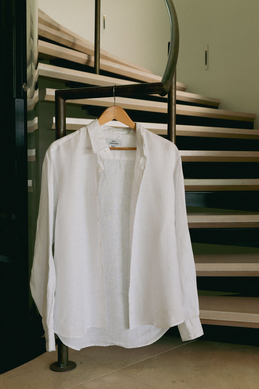 NL Linen Shirt White hanging beside the staircase at Domic, Sunshine Beach