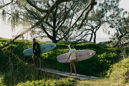 Womens Shealoha 2k25 worn on a coastal walk with surfboards near Sunshine Beach