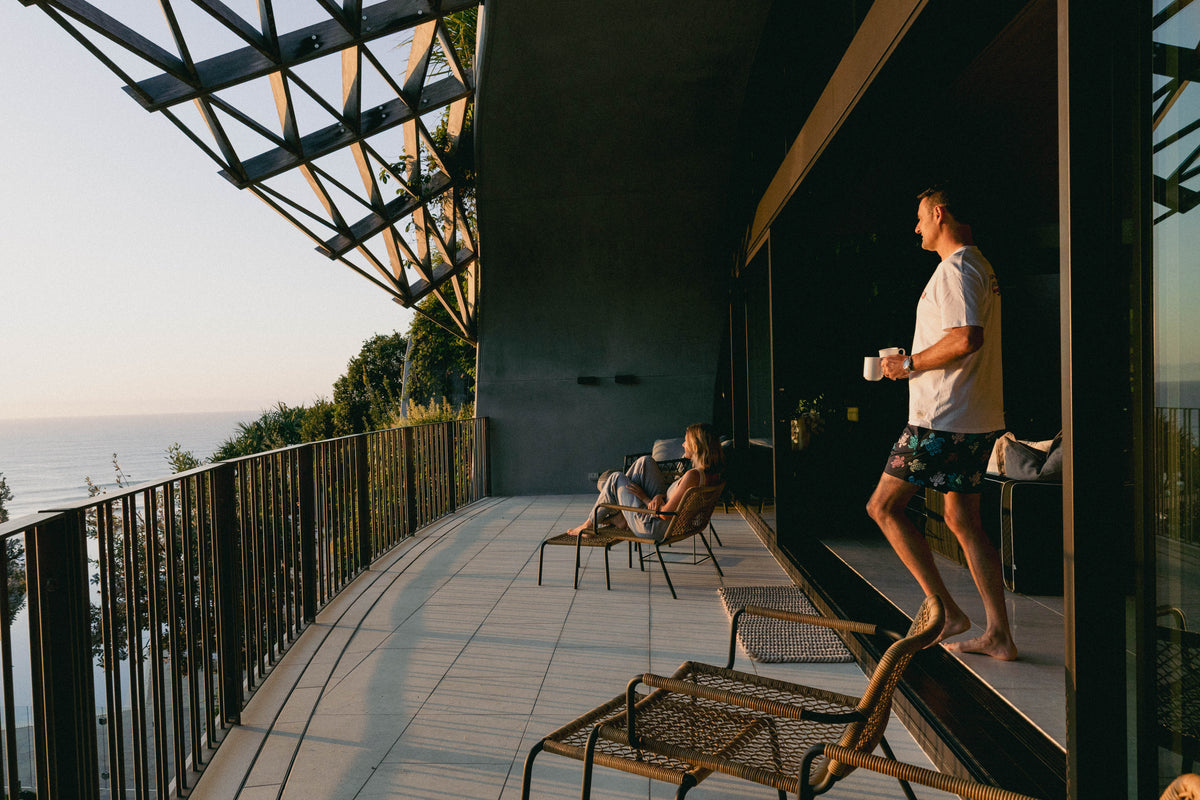 NL Original Tee – White worn while having a coffee on the balcony at Domic, Sunshine Beach