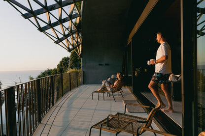 NL Original Tee – White worn while having a coffee on the balcony at Domic, Sunshine Beach
